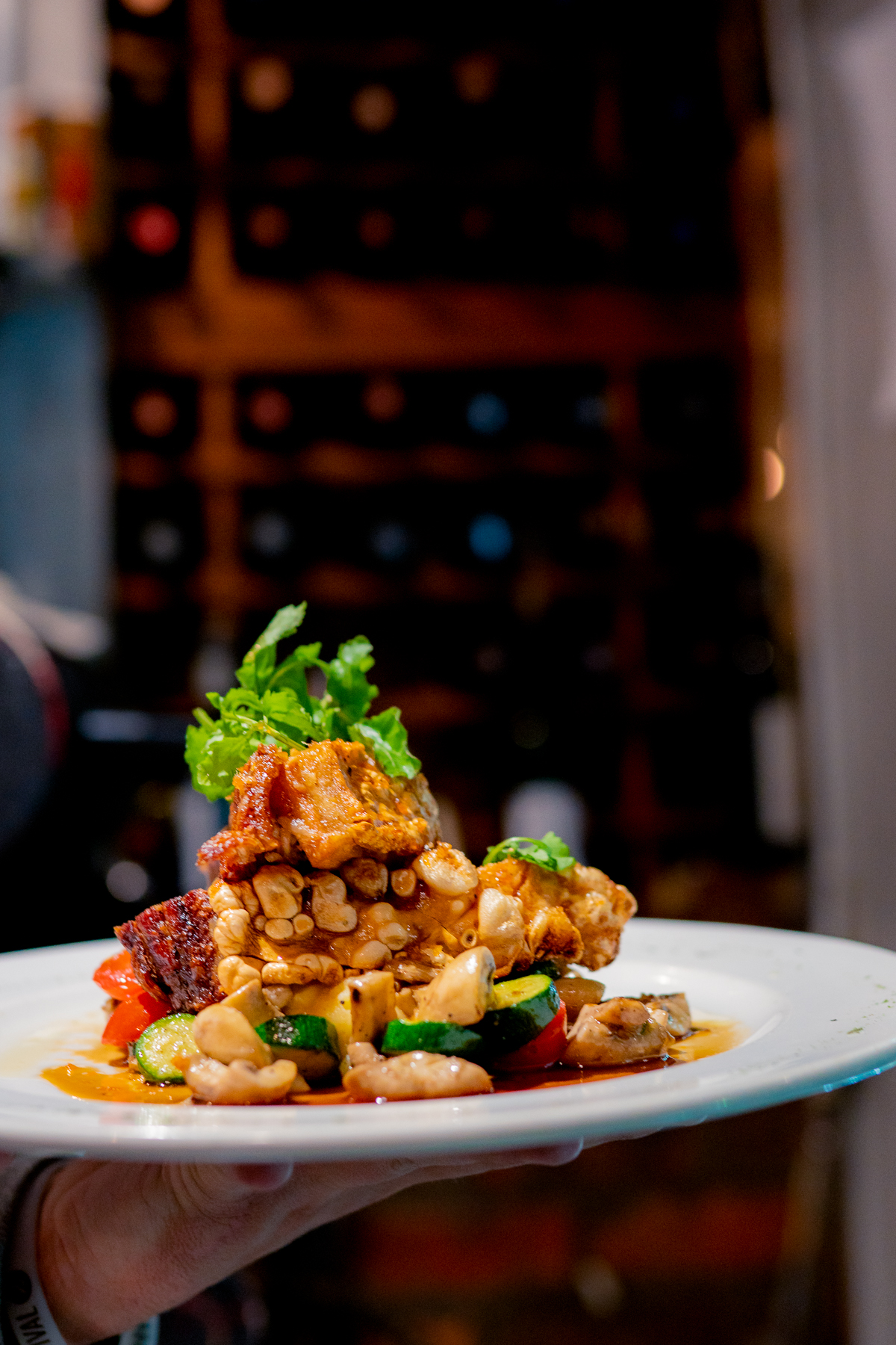 Crispy pork belly with cannellini beans and vegetables
